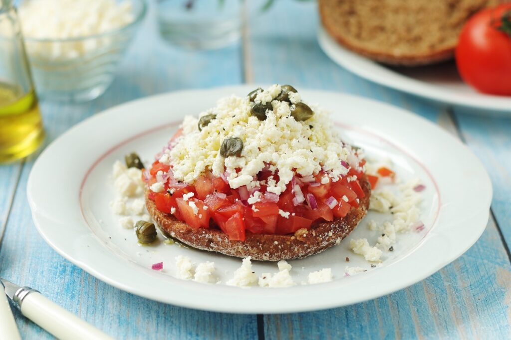 The 10 Most Popular Cretan Traditional Dishes - Gastronomy Tours dakos anoigma - Gastronomy Tours